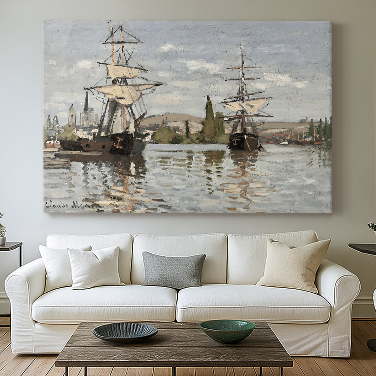 Canvas art print detailing a nautical landscape with vessels resting on calm water, centered above a sofa as a large focal wall piece