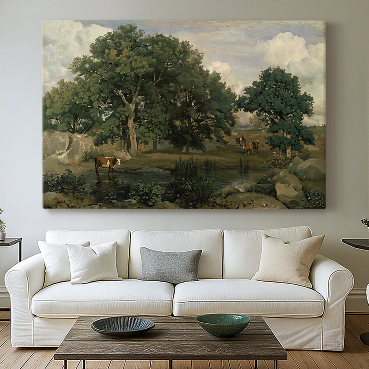 Canvas art print detailing a tranquil forest setting with atmospheric light, centered above a sofa as a large focal wall piece