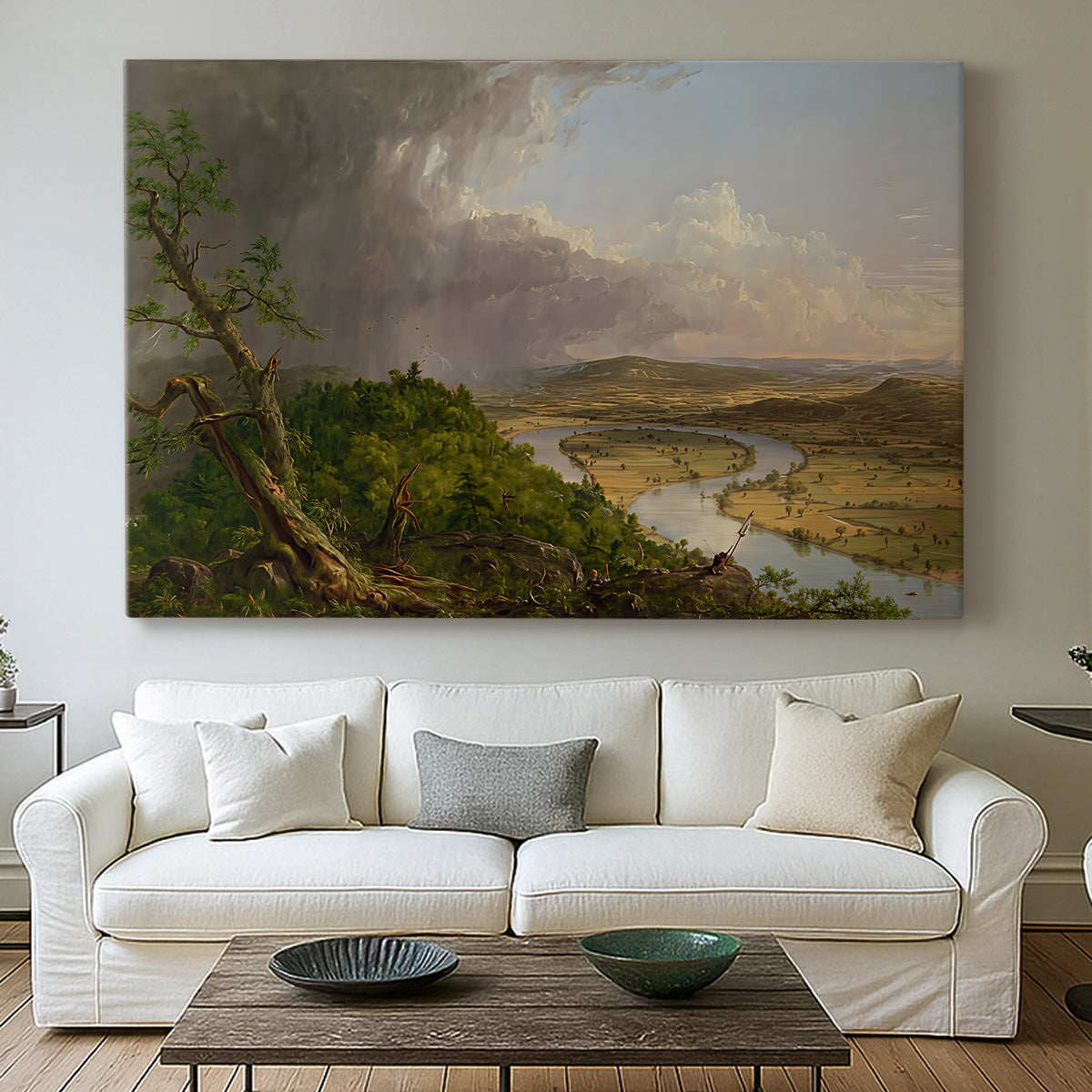 Canvas art print detailing an iconic composition with river bend and contrasting skies, centered above a sofa as a large focal wall piece