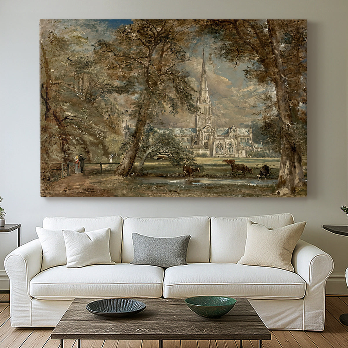 Canvas art print detailing a landscape featuring cathedral and greenery, centered above a sofa as a large focal wall piece