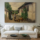 Canvas art print detailing a countryside visit scene with figures in front of rustic buildings, centered above a sofa as a large focal wall piece