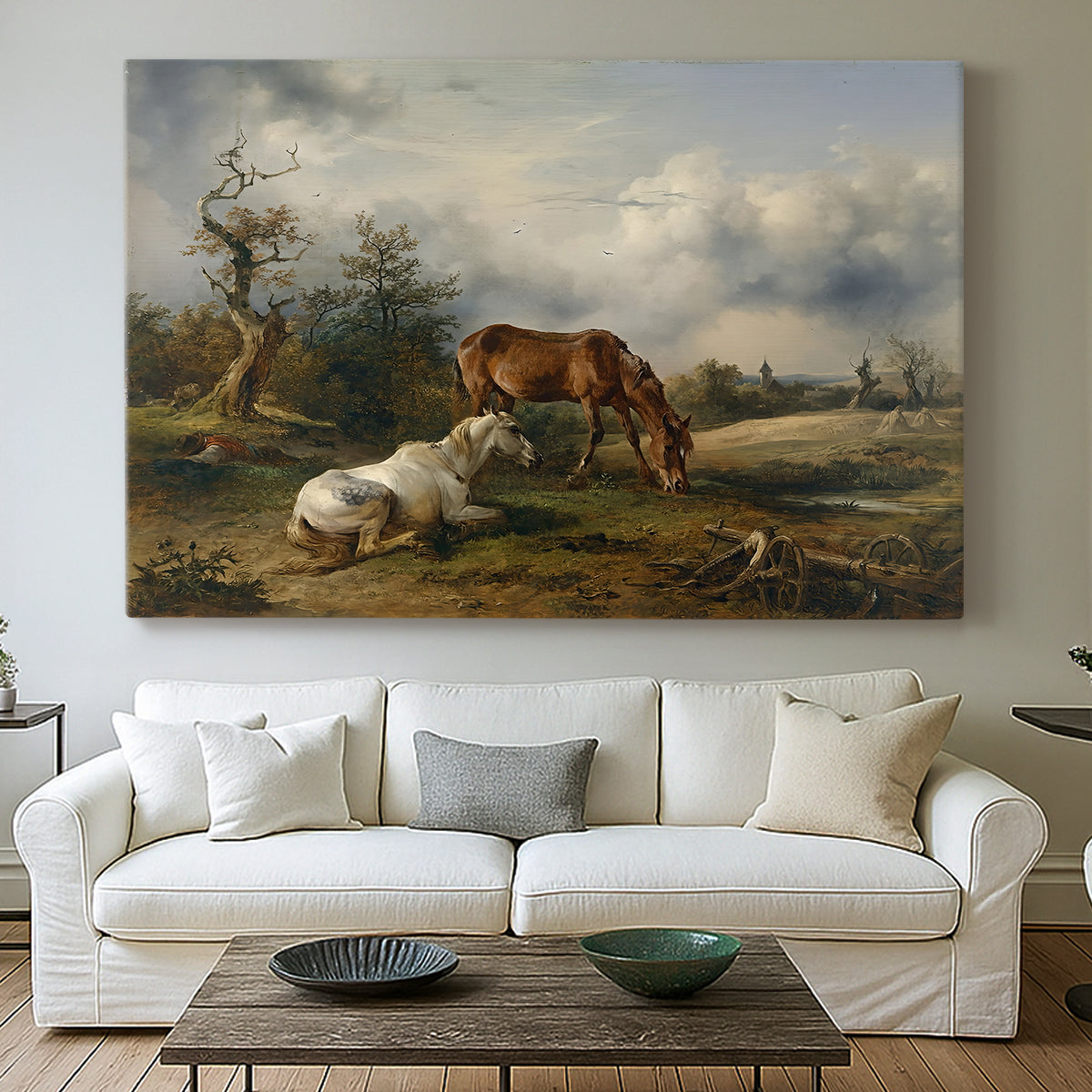Canvas art print detailing a countryside composition with grazing animals, centered above a sofa as a large focal wall piece