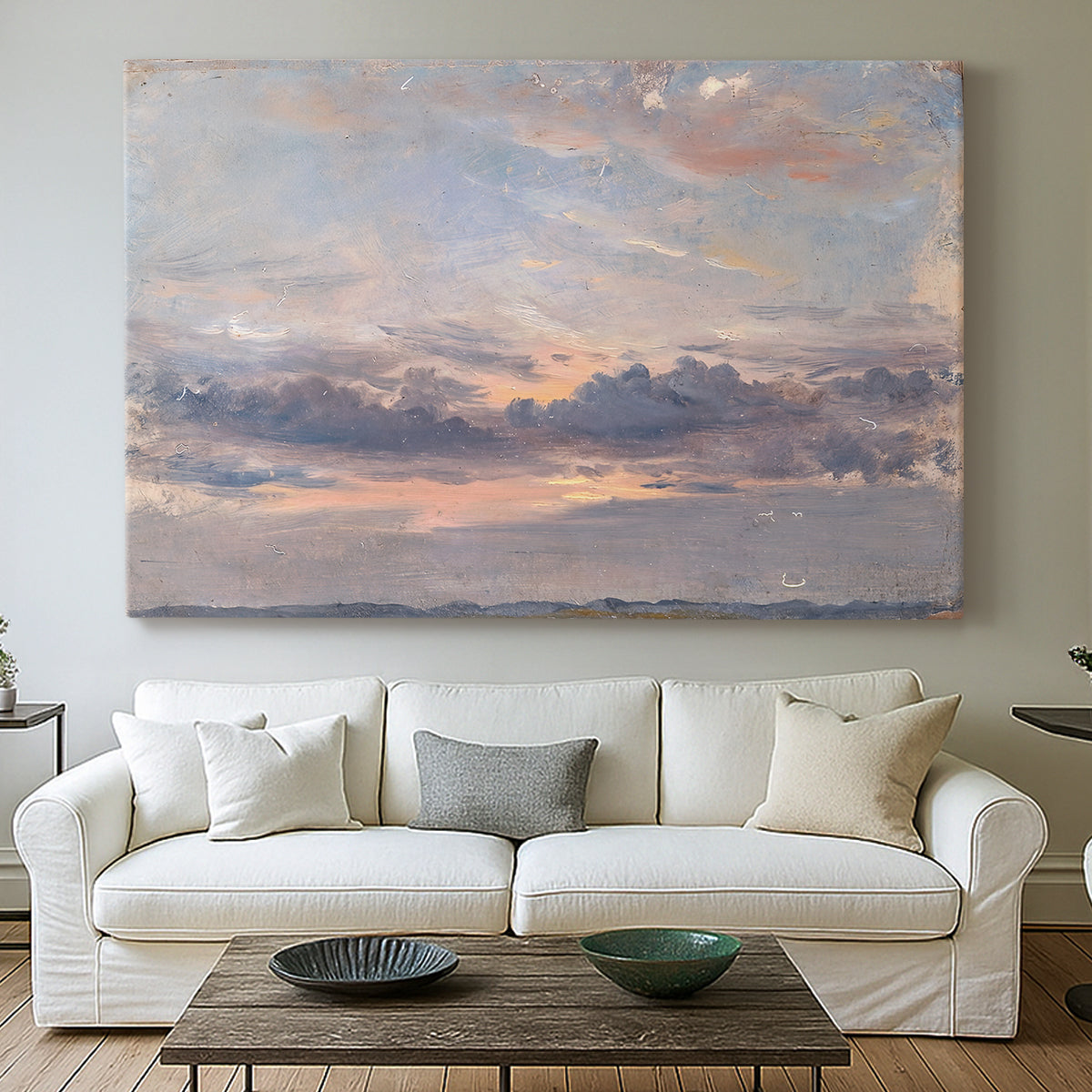Canvas art print detailing a landscape focused on cloud formations, centered above a sofa as a large focal wall piece