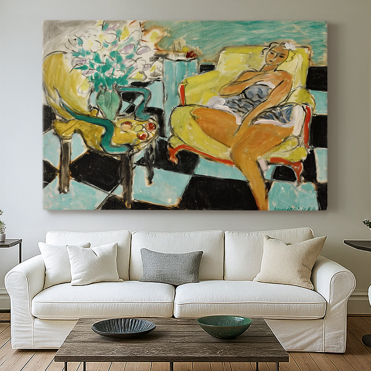 Canvas art print detailing a colorful seated portrait with a flower accent, centered above a sofa as a large focal wall piece