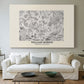 Canvas art print detailing a textile-style floral composition with repeating motifs, centered above a sofa as a large focal wall piece