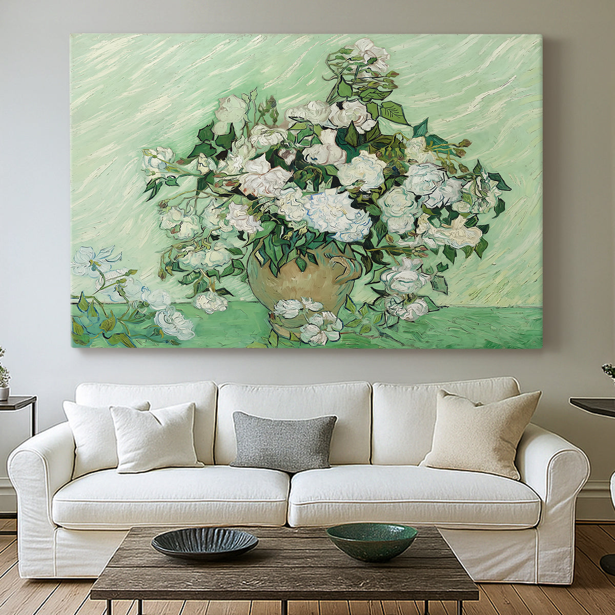 Canvas art print detailing a stylized botanical scene with soft tones, centered above a sofa as a large focal wall piece