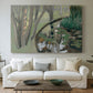 Canvas art print detailing a stylized landscape centered on water, centered above a sofa as a large focal wall piece