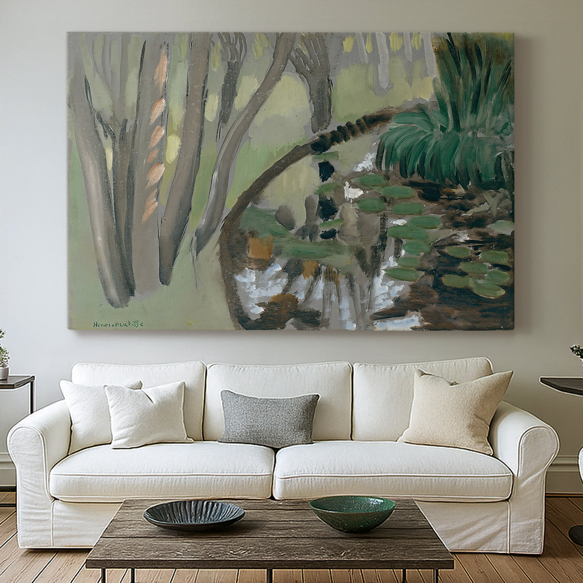 Canvas art print detailing a stylized landscape centered on water, centered above a sofa as a large focal wall piece