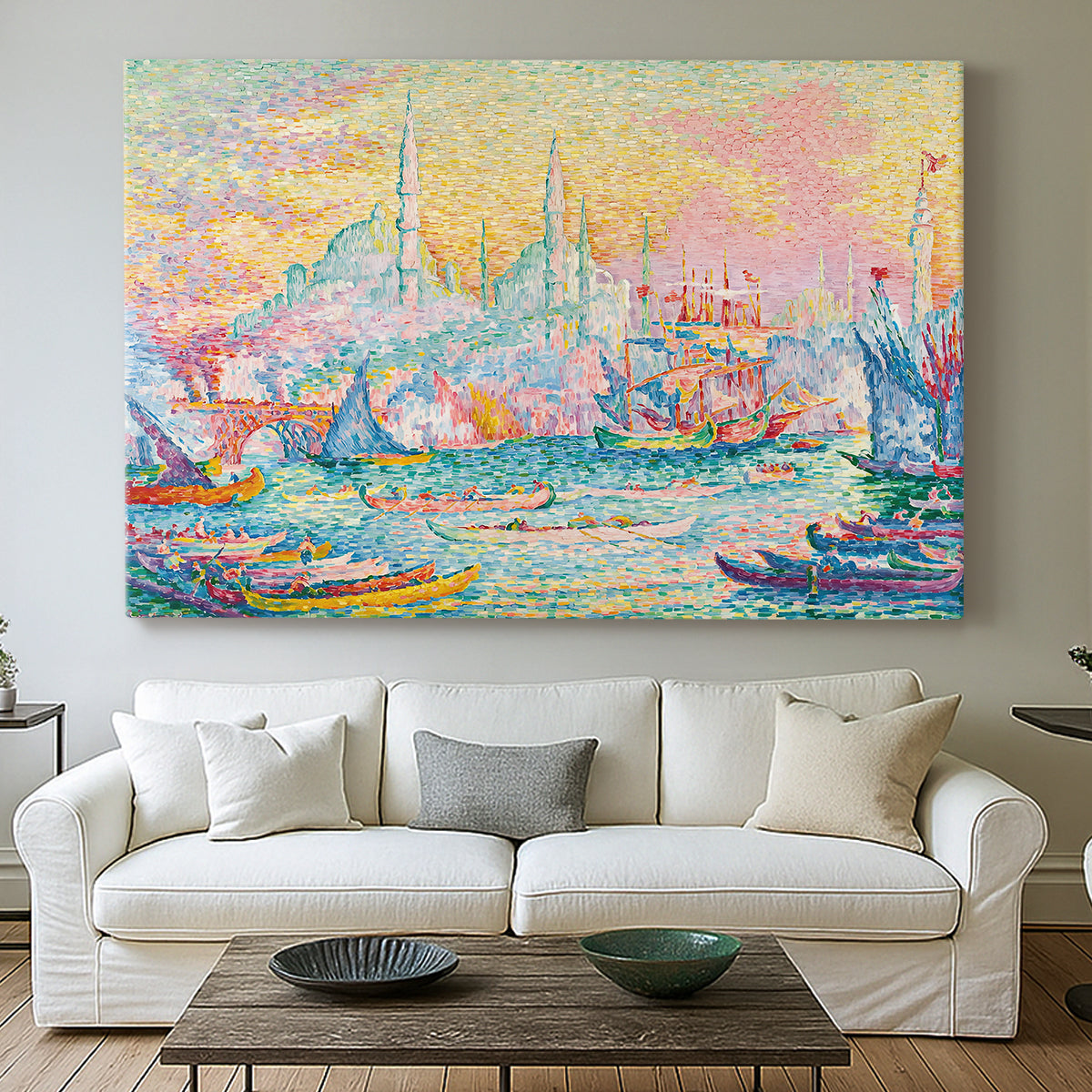 Canvas art print detailing a coastal cityscape, centered above a sofa as a large focal wall piece