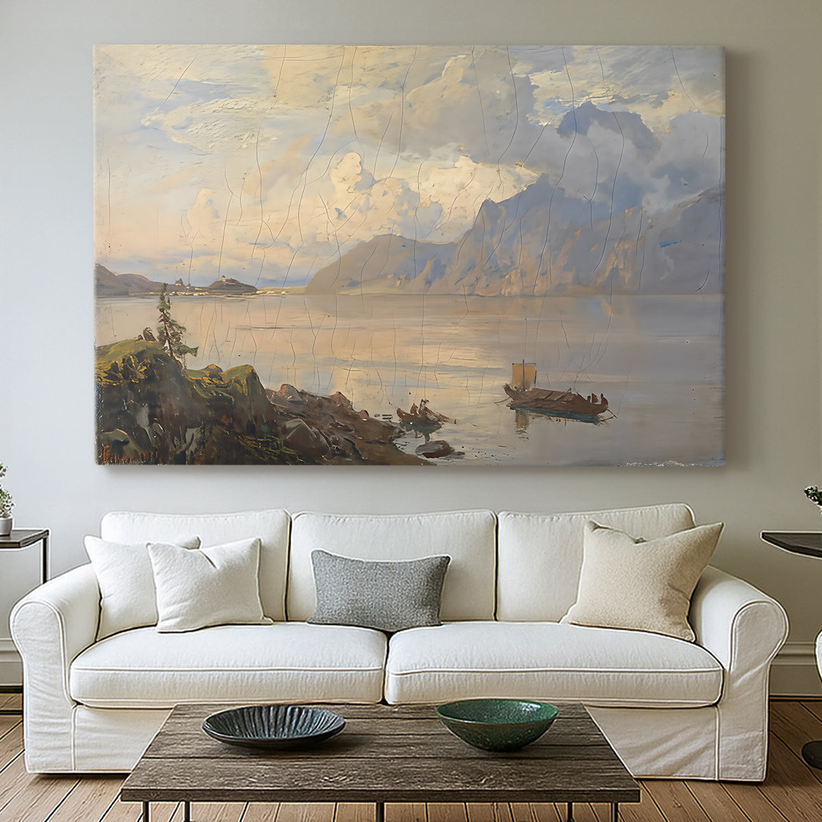 Canvas art print detailing a serene natural setting with water and mountainous backdrop, centered above a sofa as a large focal wall piece