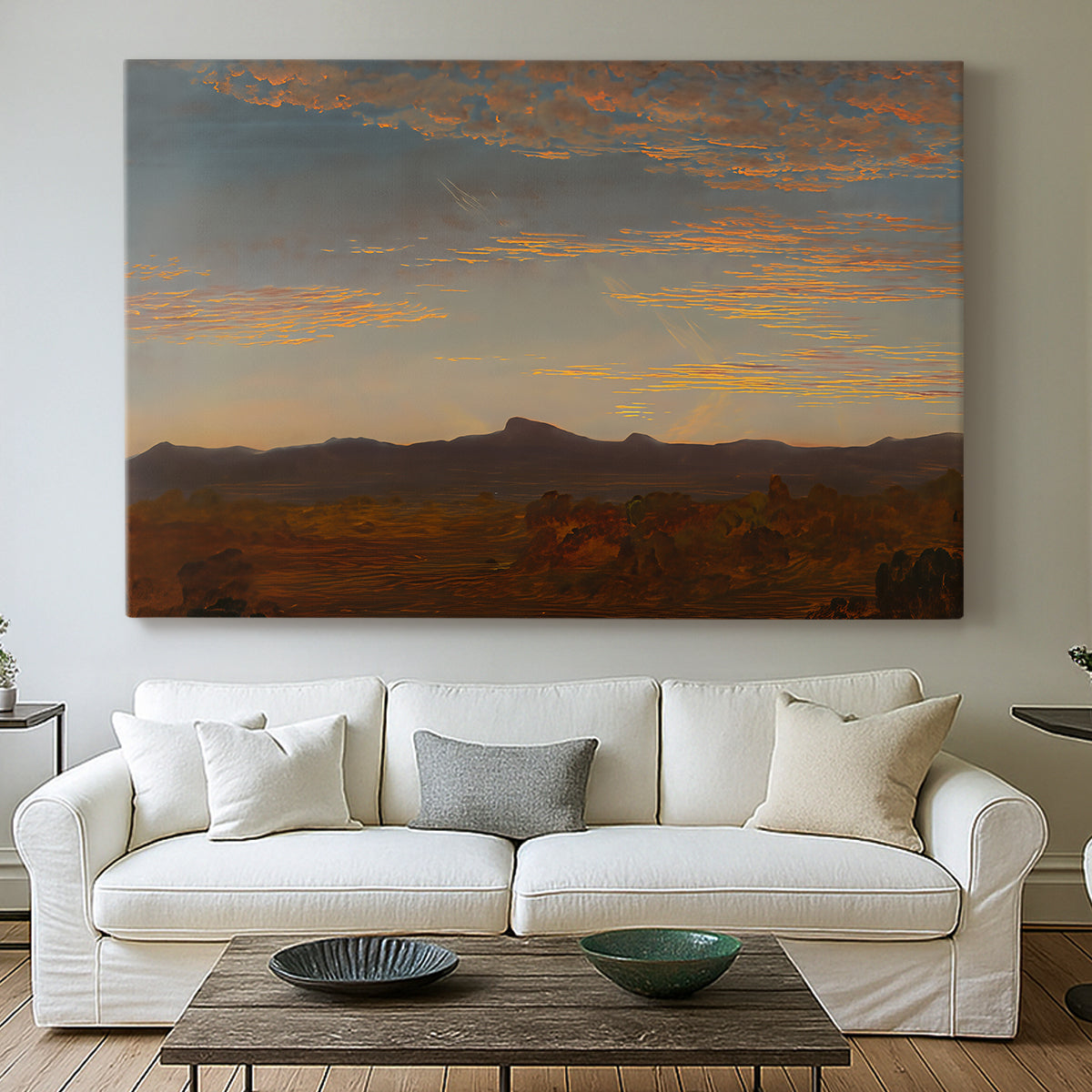 Canvas art print detailing a panoramic natural view with low mountains and open plain, centered above a sofa as a large focal wall piece