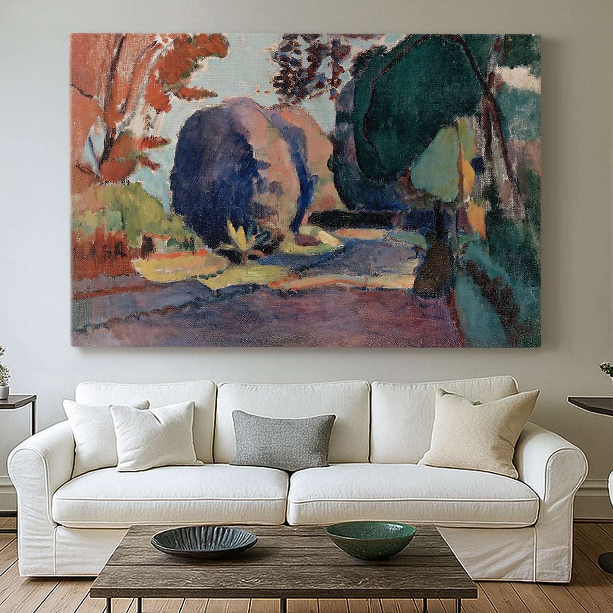 Canvas art print detailing a colorful landscape view of a garden, centered above a sofa as a large focal wall piece
