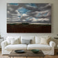Canvas art print detailing a landscape emphasizing mood, centered above a sofa as a large focal wall piece