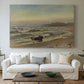 Canvas art print detailing a dramatic coastal weather scene with churning waves, centered above a sofa as a large focal wall piece