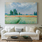 Canvas art print detailing a serene rural scene with textured wheat under natural light, centered above a sofa as a large focal wall piece
