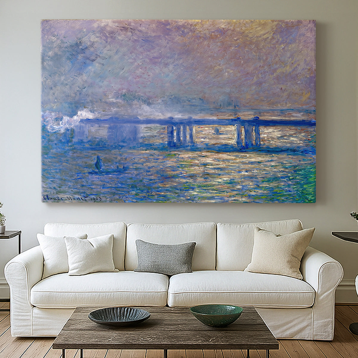 Canvas art print detailing a city bridge scene softened by mist and impressionist brushwork, centered above a sofa as a large focal wall piece