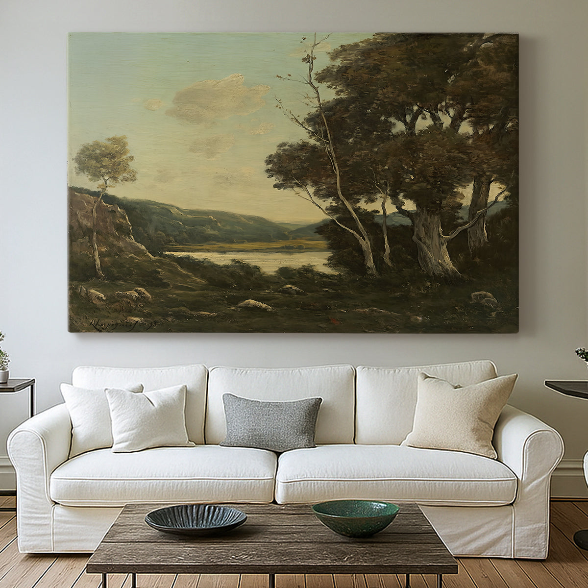 Canvas art print detailing a tranquil countryside view with soft atmospheric tones, centered above a sofa as a large focal wall piece