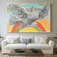 Canvas art print detailing a graphic depiction of bird with rainbow, centered above a sofa as a large focal wall piece
