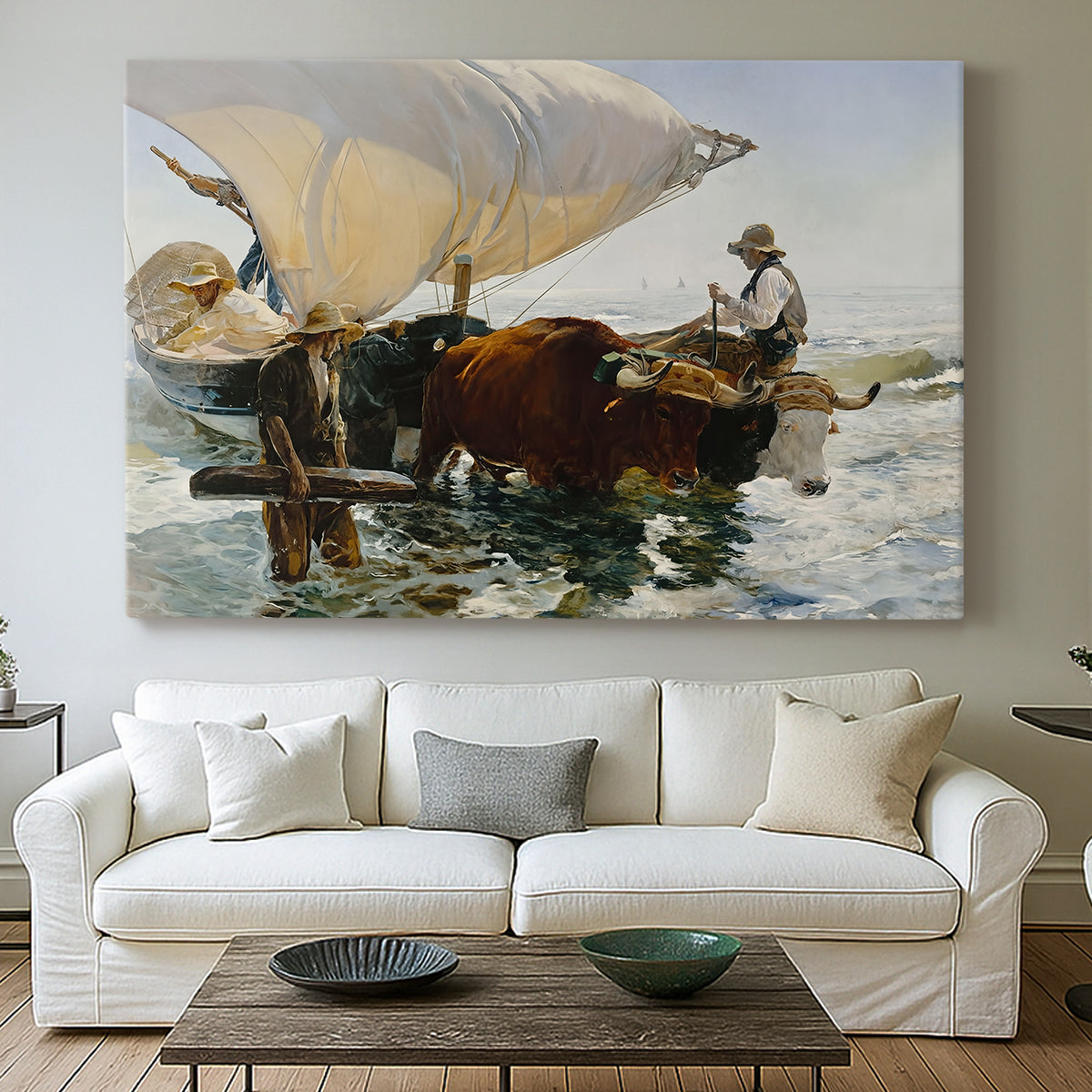 Canvas art print detailing an impressionist beach scene showing teamwork, centered above a sofa as a large focal wall piece