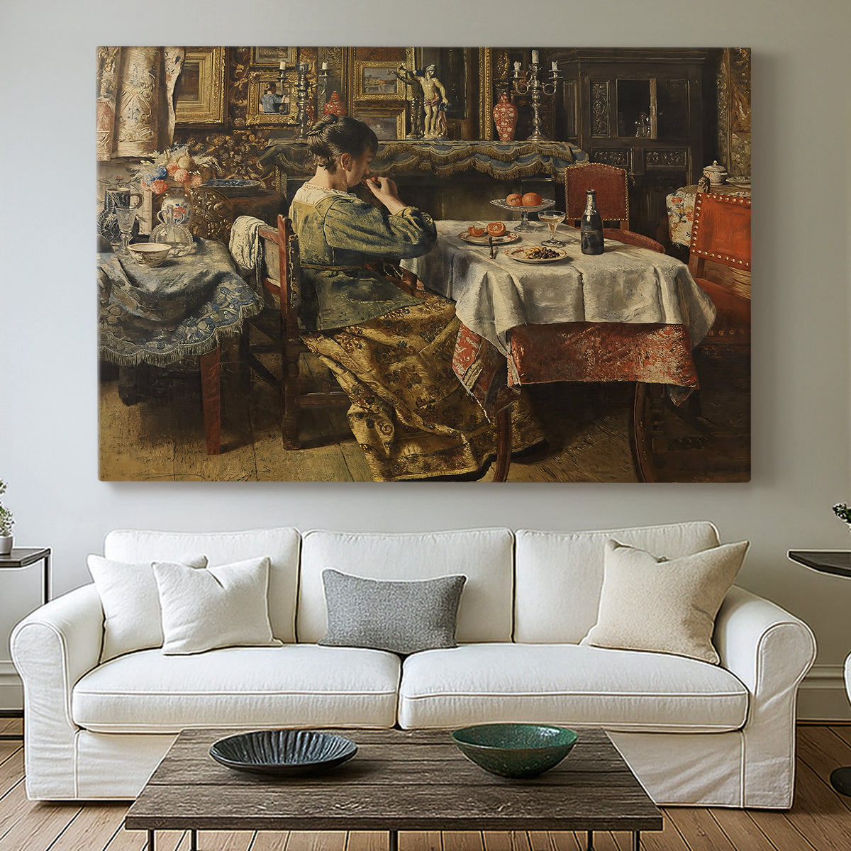 Canvas art print detailing an everyday life scene centered around communal meal, centered above a sofa as a large focal wall piece