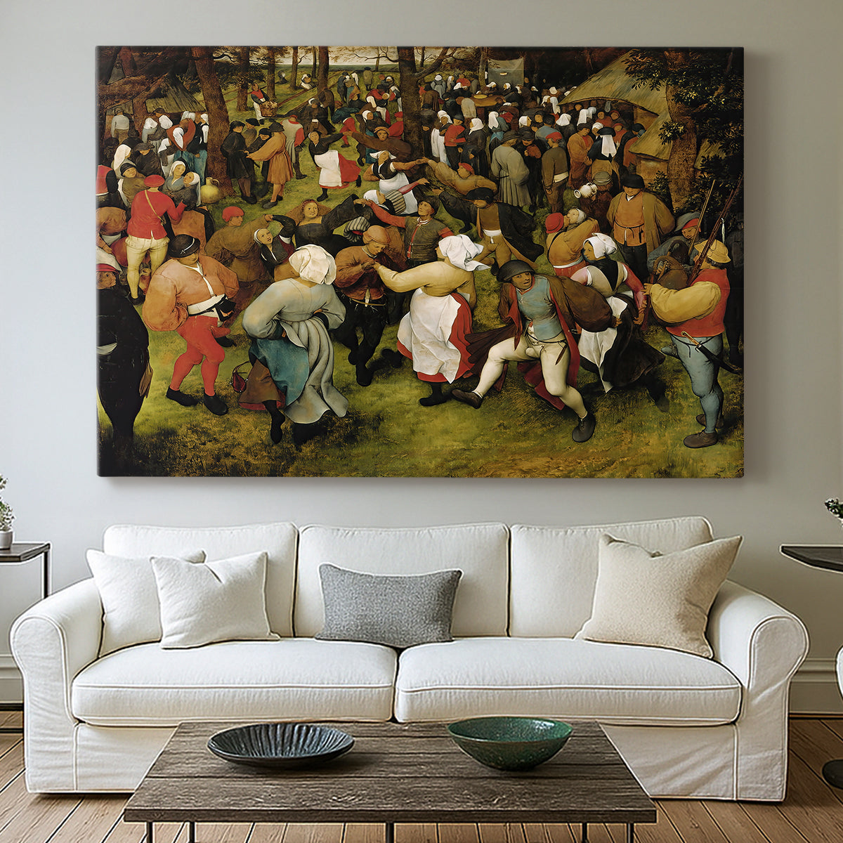 Canvas art print detailing a traditional village wedding scene, centered above a sofa as a large focal wall piece