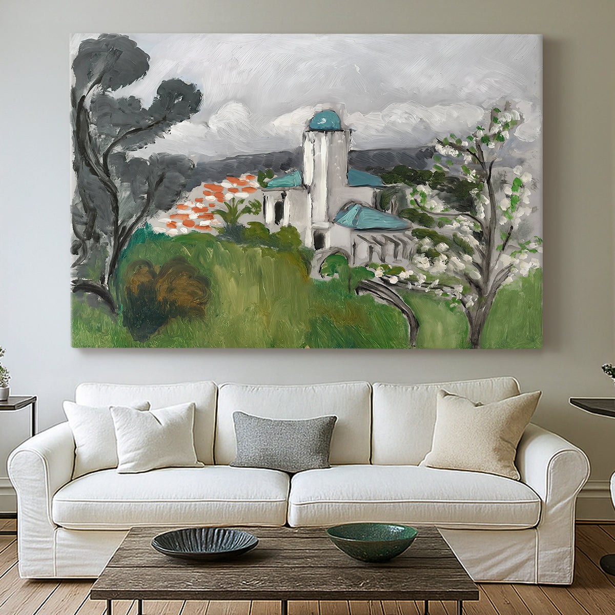 Canvas art print detailing a colorful scene of a villa among trees and vegetation, centered above a sofa as a large focal wall piece