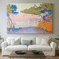 Canvas art print detailing a coastal composition with land and water in balance, centered above a sofa as a large focal wall piece