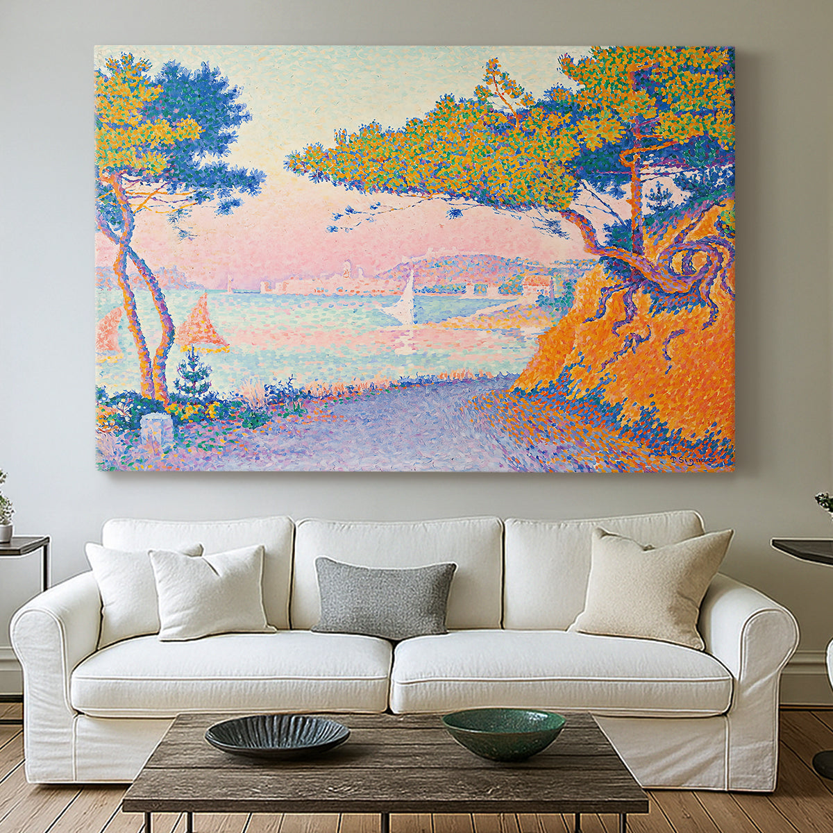 Canvas art print detailing a coastal composition with land and water in balance, centered above a sofa as a large focal wall piece