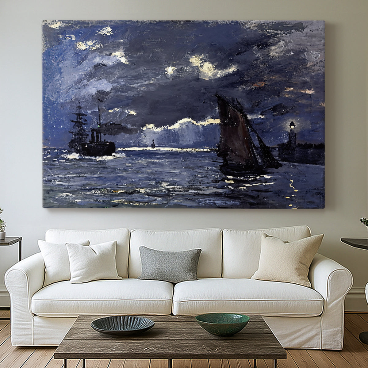 Canvas art print detailing an atmospheric maritime view with ships in moonlit darkness, centered above a sofa as a large focal wall piece