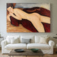Canvas art print detailing a stylized depiction of woman's back and form in reclining pose, centered above a sofa as a large focal wall piece