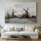 Canvas art print detailing a landscape featuring windmills and low horizon sky, centered above a sofa as a large focal wall piece