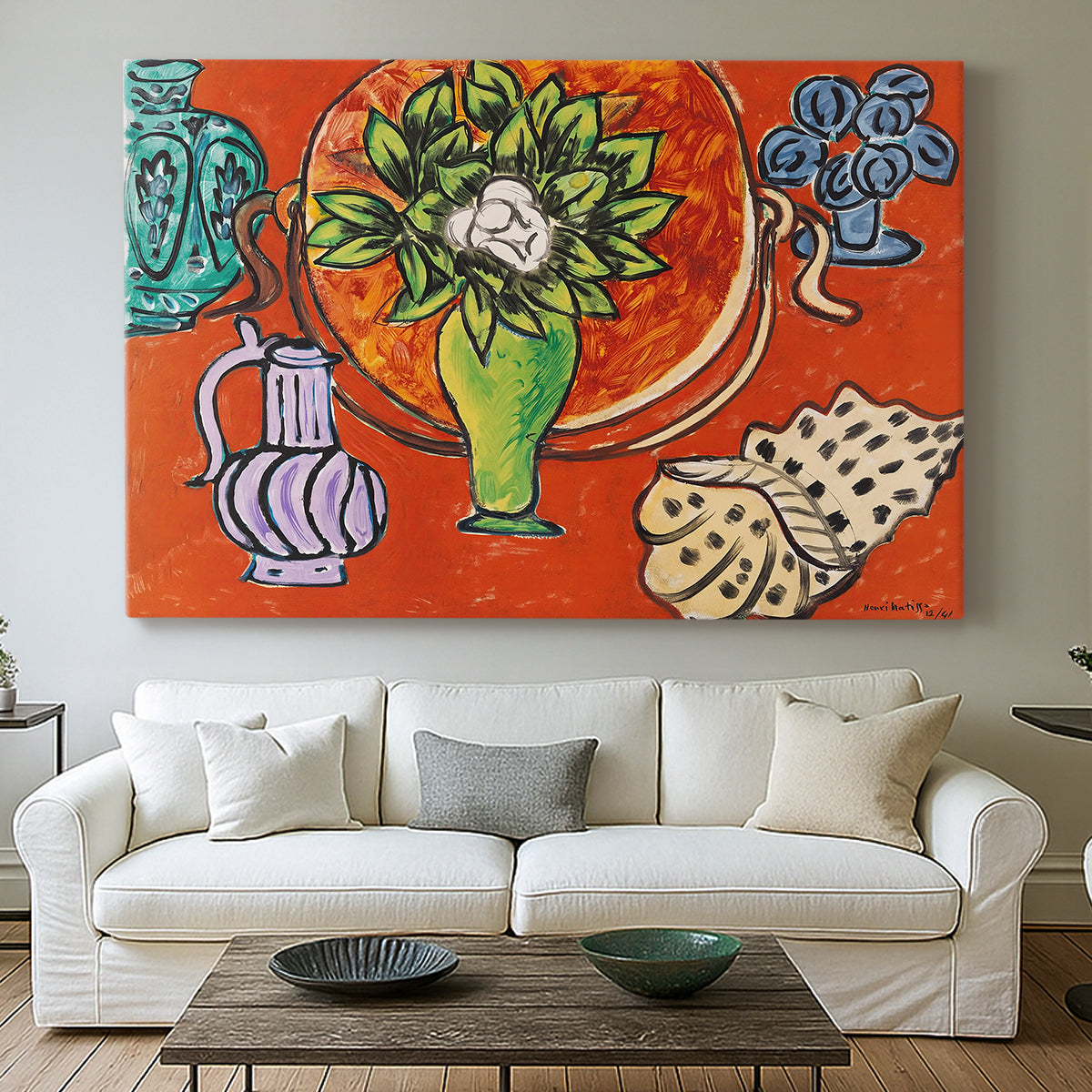 Canvas art print detailing a stylized still life featuring magnolia blossoms, centered above a sofa as a large focal wall piece