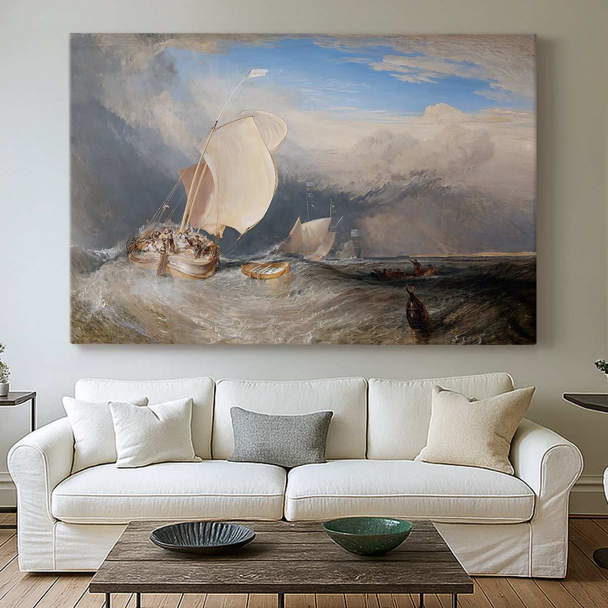 Canvas art print detailing a seaside view featuring boats, figures, and trade, centered above a sofa as a large focal wall piece
