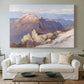 Canvas art print detailing an expansive mountainous landscape with natural depth, centered above a sofa as a large focal wall piece