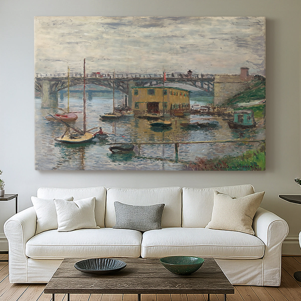 Canvas art print detailing a subdued urban landscape with structure spanning river, centered above a sofa as a large focal wall piece