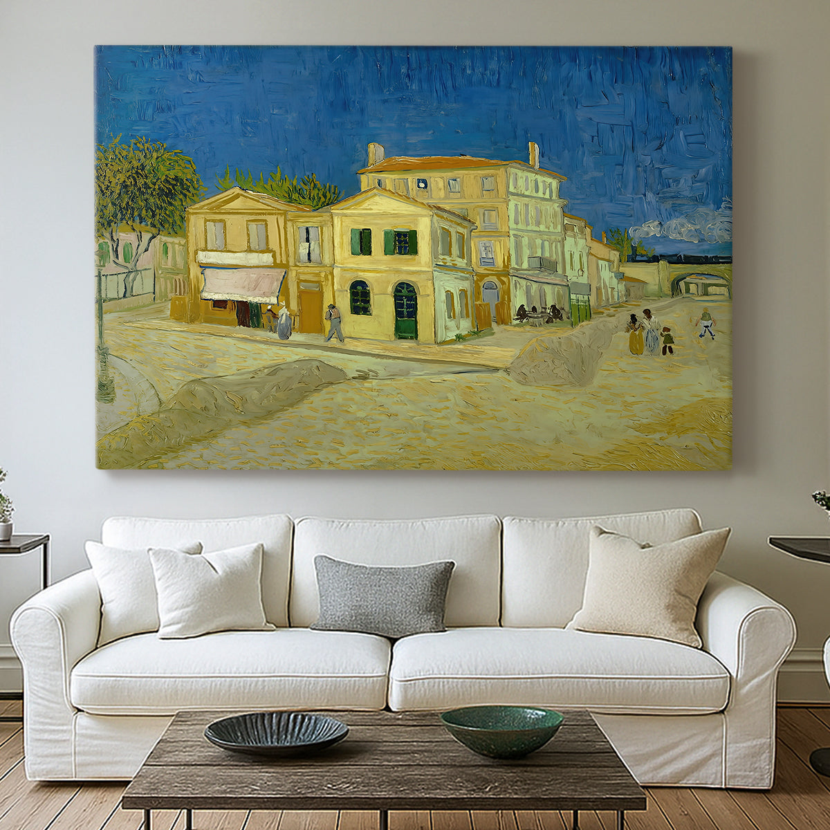 Canvas art print detailing a cityscape centered on structure and surrounding roadway, centered above a sofa as a large focal wall piece