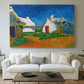 Canvas art print detailing a stylized cityscape with cottages and sky, centered above a sofa as a large focal wall piece