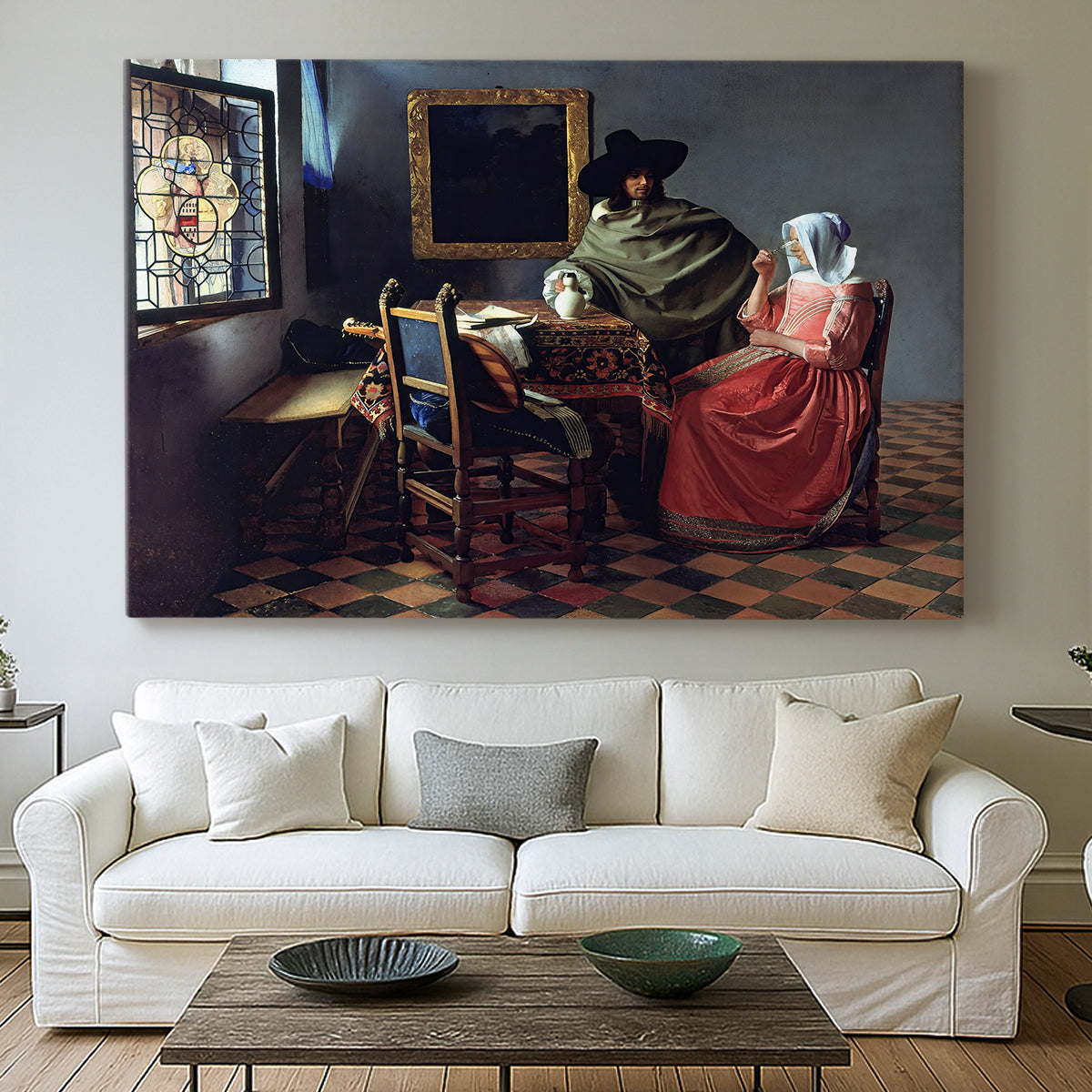Canvas art print detailing an intimate scene with figures and table setting, centered above a sofa as a large focal wall piece