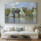 Canvas art print detailing a waterfront architecture with still reflections, centered above a sofa as a large focal wall piece