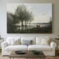 Canvas art print detailing an atmospheric natural setting with marsh and soft sky, centered above a sofa as a large focal wall piece