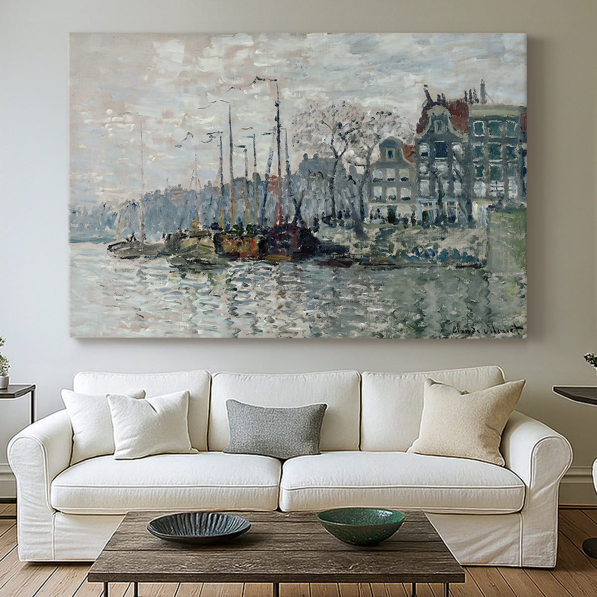 Canvas art print detailing a harbor view with masts, houses, and reflections in water, centered above a sofa as a large focal wall piece