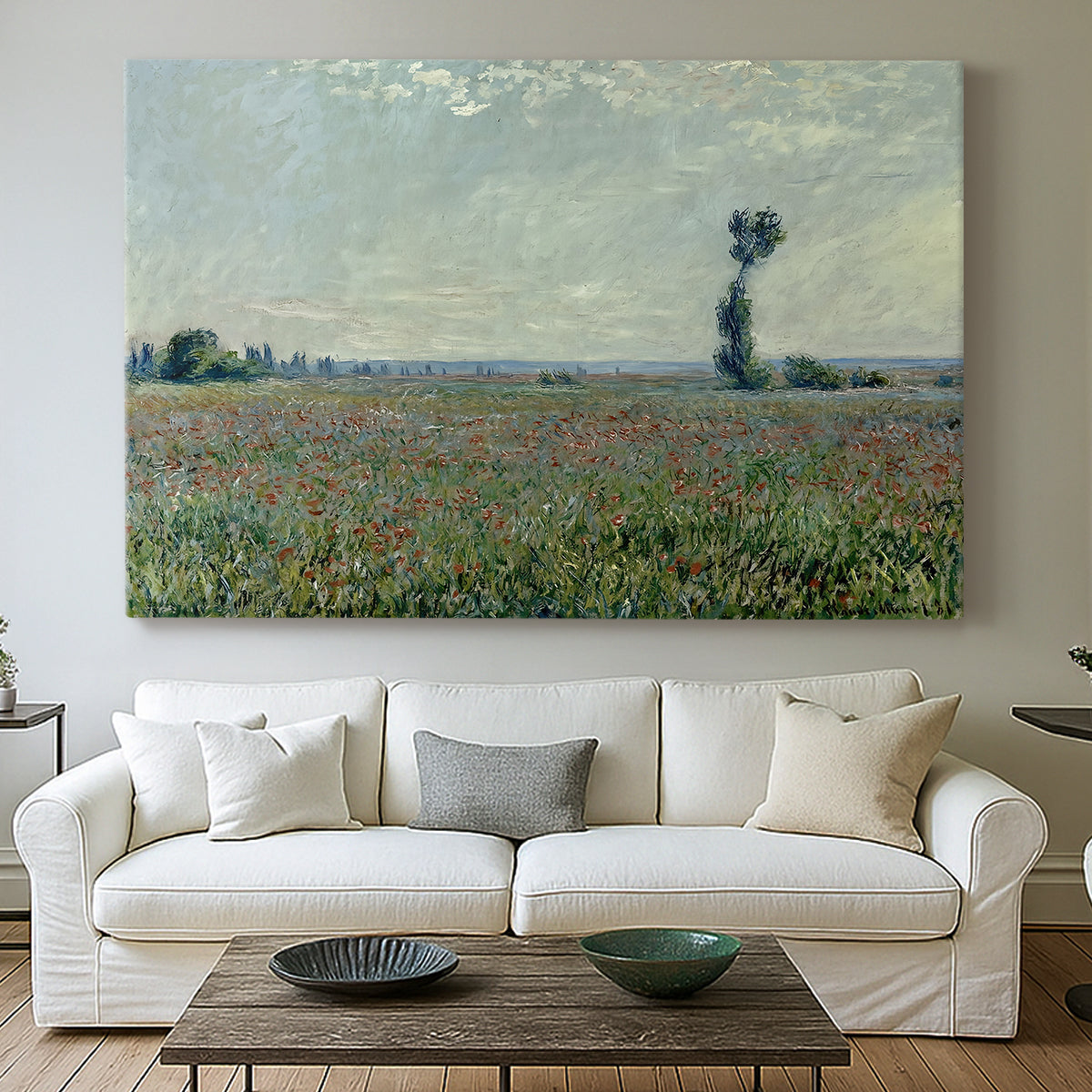 Canvas art print detailing a natural field scene with vibrant red flowers, centered above a sofa as a large focal wall piece