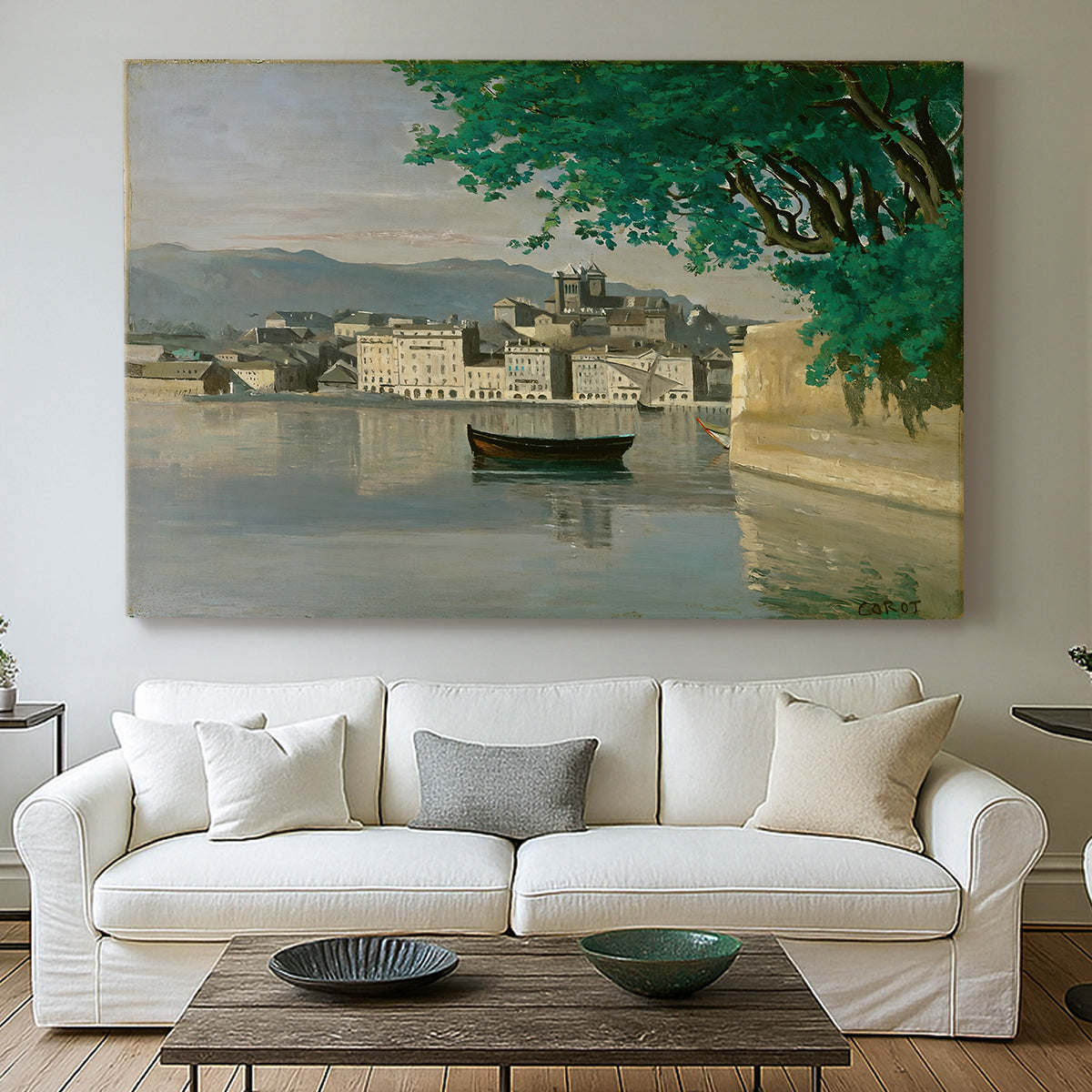 Canvas art print detailing a tranquil scene combining buildings, water, and sky, centered above a sofa as a large focal wall piece