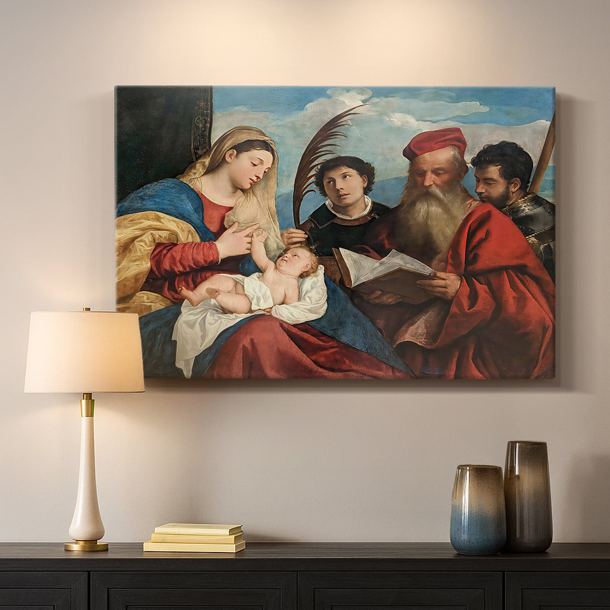 Canvas art print detailing a devotional composition with multiple saints surrounding central pair, mounted in a softly lit interior space