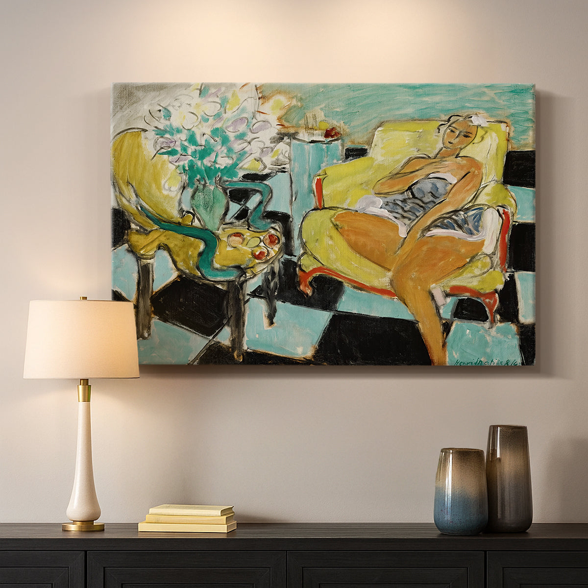 Canvas art print detailing a colorful seated portrait with a flower accent, mounted in a softly lit interior space
