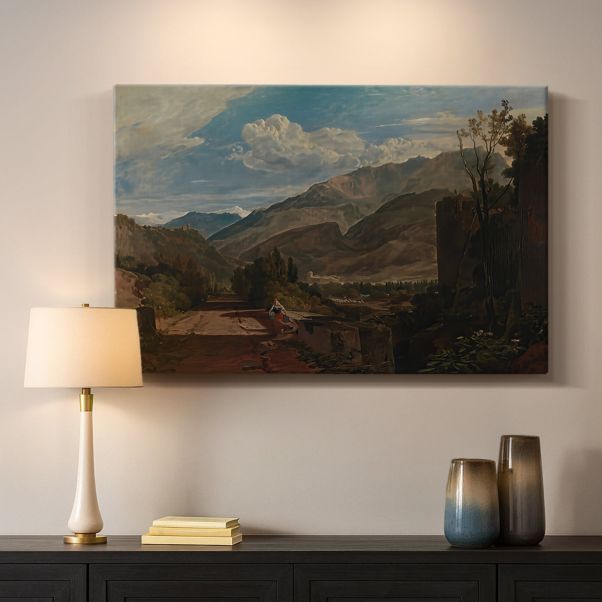 Canvas art print detailing a scenic mountain setting, mounted in a softly lit interior space