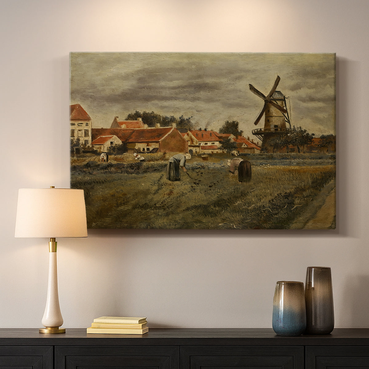 Canvas art print detailing an outdoor scene combining architecture and labor, mounted in a softly lit interior space