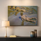 Canvas art print detailing a coastal composition with boys and sand, mounted in a softly lit interior space