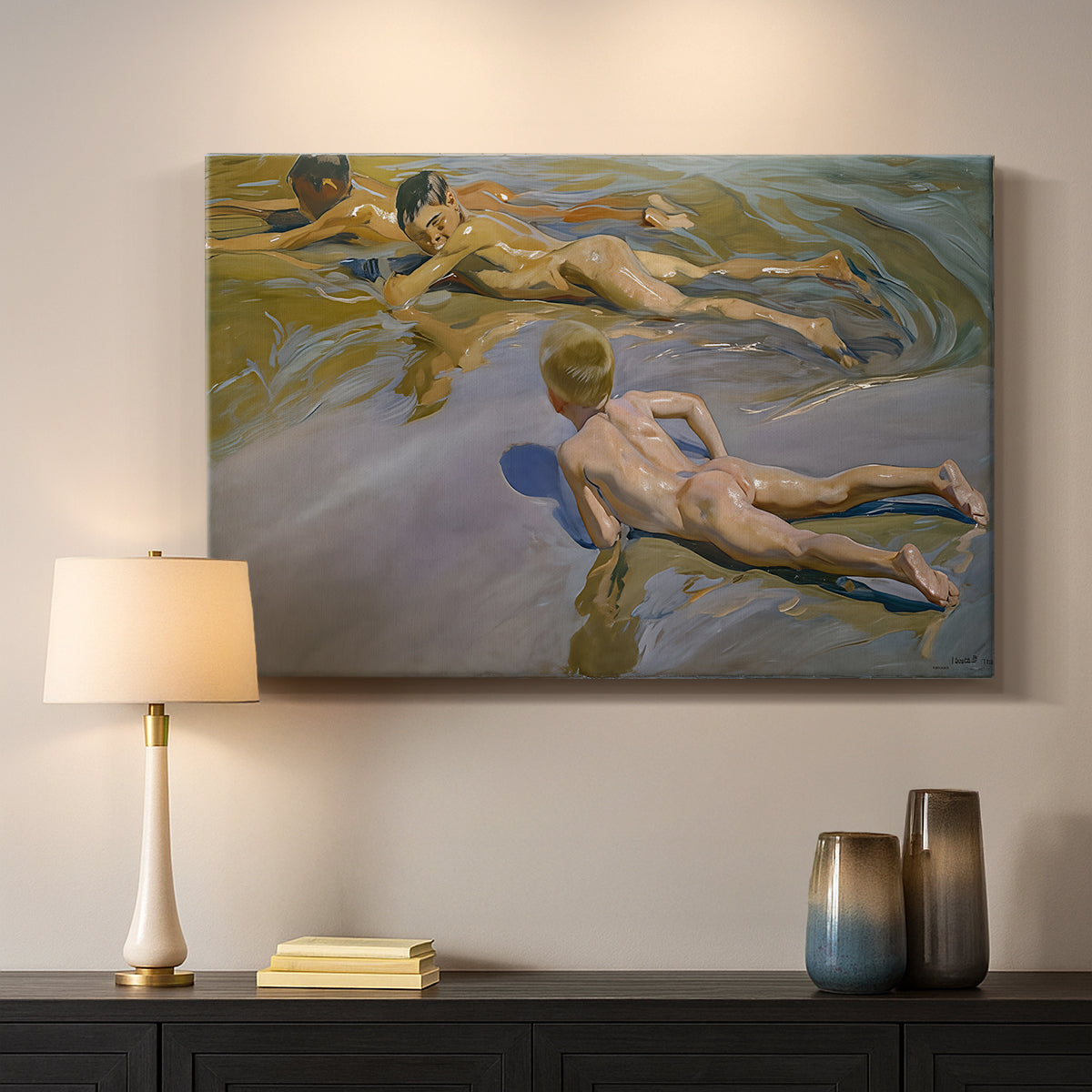 Canvas art print detailing a coastal composition with boys and sand, mounted in a softly lit interior space