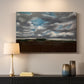 Canvas art print detailing a landscape emphasizing mood, mounted in a softly lit interior space